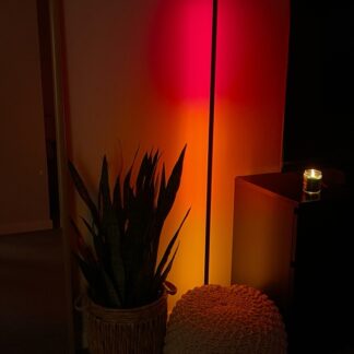 Image of a Luna Red Luminaire lighting a dimly lit room