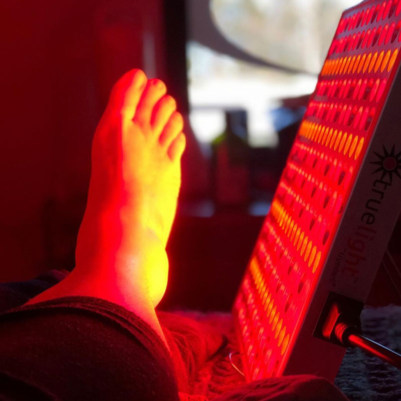 Image of a foot being treated with Red Light Therapy.