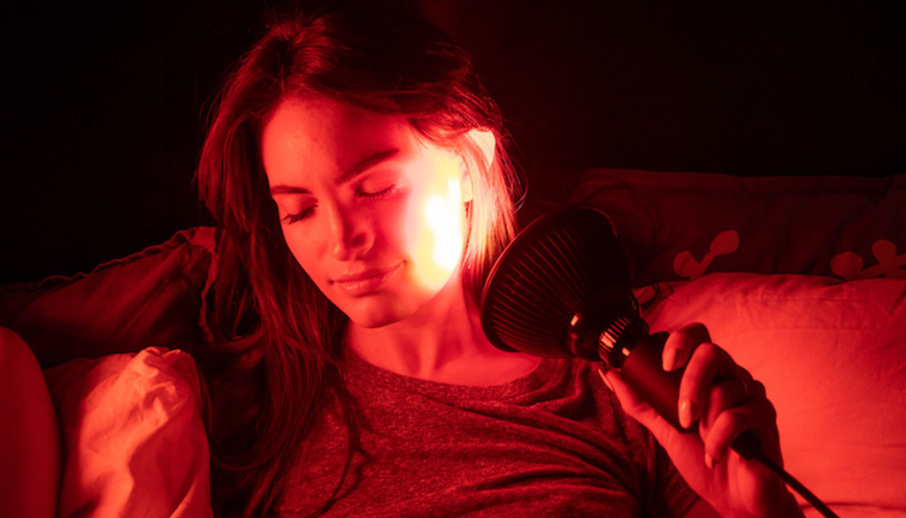Image of woman using Red Light Therapy